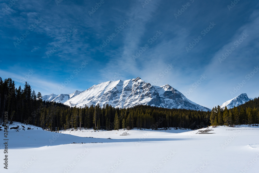 Winter in the mountains under clear blue skies Winter in the mountains under clear blue skies