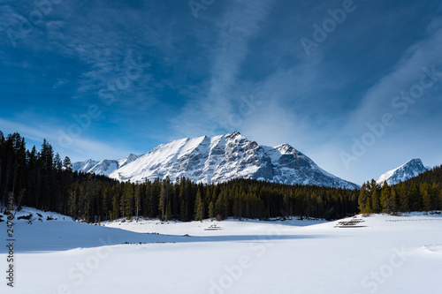 Winter in the mountains under clear blue skies