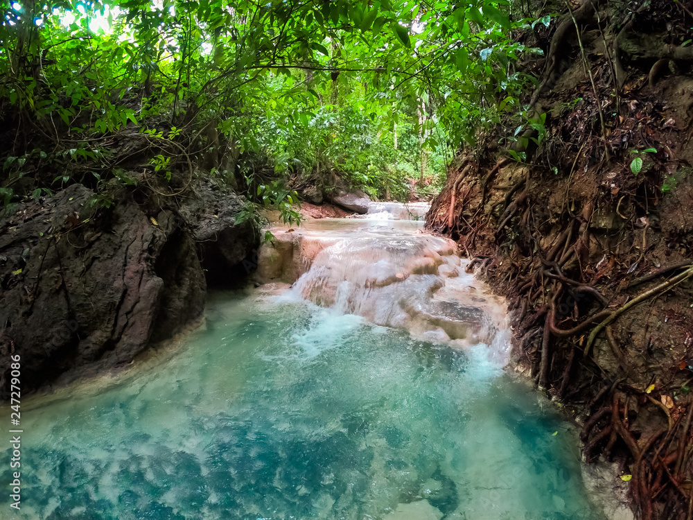 Naklejka premium River in a mountain gorge in the tropical jungle of the Philippines.
