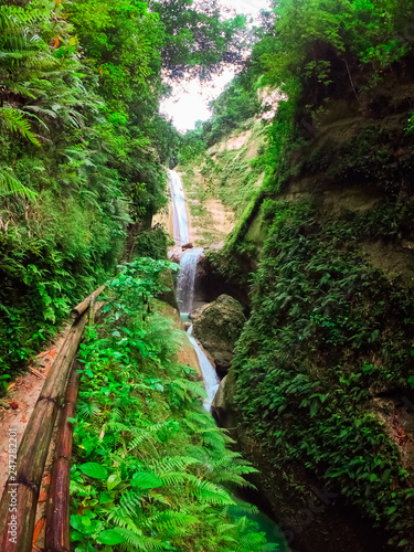 Waterfalls in a mountain gorge in the tropical jungle of the Philippines, Cebu.