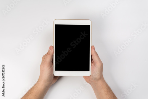 Man working with tablet, top view