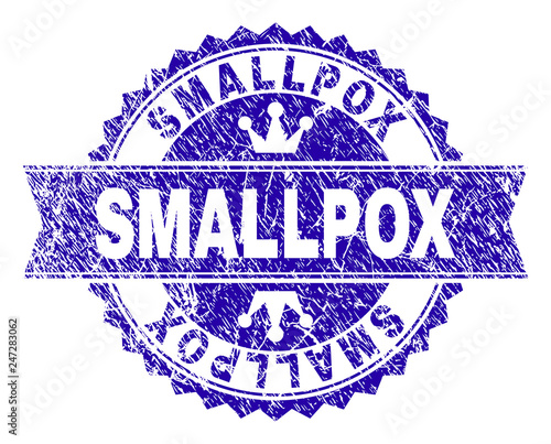 SMALLPOX rosette stamp imitation with grunge texture. Designed with round rosette, ribbon and small crowns. Blue vector rubber print of SMALLPOX caption with grunge texture.