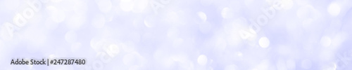 A brilliant blurry background of blue. Template for a holiday greeting card and labels with a pattern of circles with neon glitter.