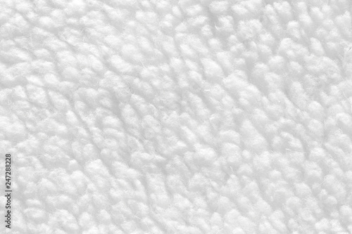 White sheep fur with a texture of fibers. Pattern soft canvas for various purposes.