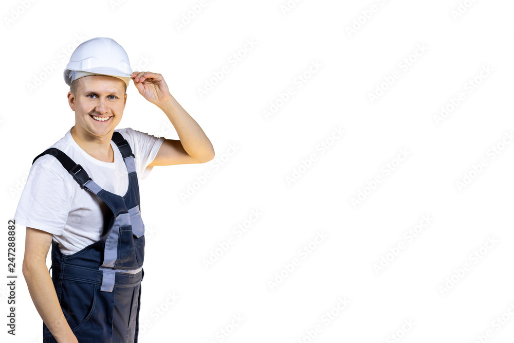 Successful construction engineer in a white helmet welcomes you at work. Welcome. Isolated Successful construction engineer in a white helmet welcomes you at work. Welcome. Isolated