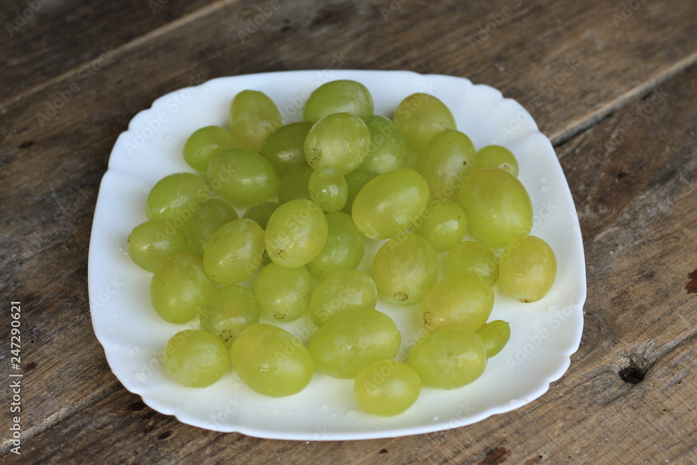 grape on the white plate grape on the white plate