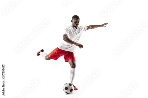 Professional african american football soccer player in motion isolated on white studio background. Fit jumping man in action, jump, movement at game. © master1305