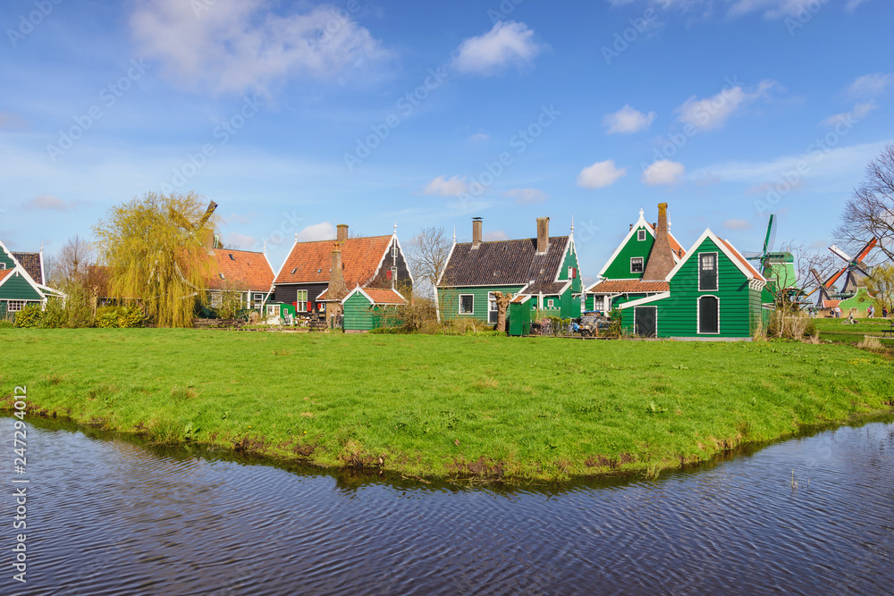 Amsterdam Netherlands, Dutch Windmill and traditional house at Zaanse Schans Village Amsterdam Netherlands, Dutch Windmill and traditional house at Zaanse Schans Village