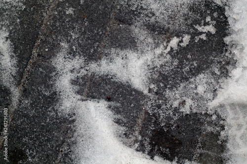 Snow on pavement.