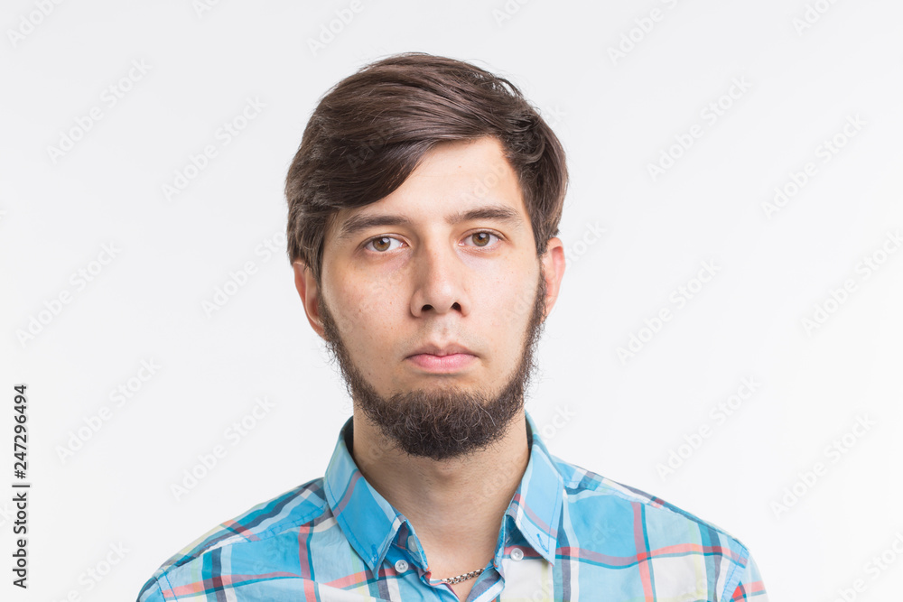 Fototapeta premium People, gesture and emotions concept - Sad bearded man on white background