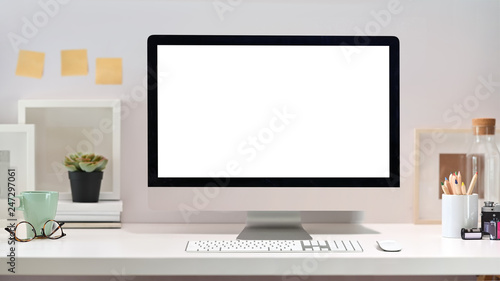 Stylish creative loft workspace with blank screen computer