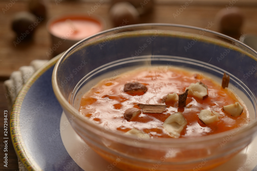 persimmon smoothied in cup with dried fruit an cinnamon
persimmon smoothied in cup with dried fruit an cinnamon