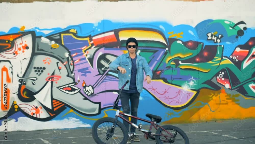 A man throwing his bike on a ground, slow motion. A man throwing his bike on a ground, slow motion.