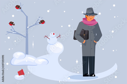 Man walking through a snow covered park