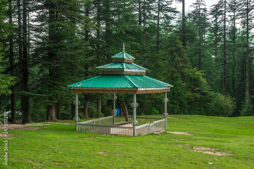 A Temple in Green meadows in himalayas, Great Himalayan National Park, Sainj Valley, Himachal Pradesh, India