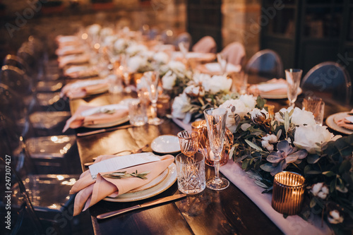 Fotografie in backyard of villa in Tuscany there is banquet wooden table decorated with cot