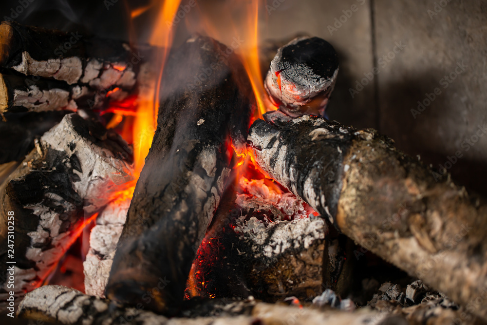 A fire is burning in the fireplace, slowly coal is being produced A fire is burning in the fireplace, slowly coal is being produced