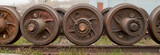 Old spare railway wheels on the axle in a repair workshop – Image