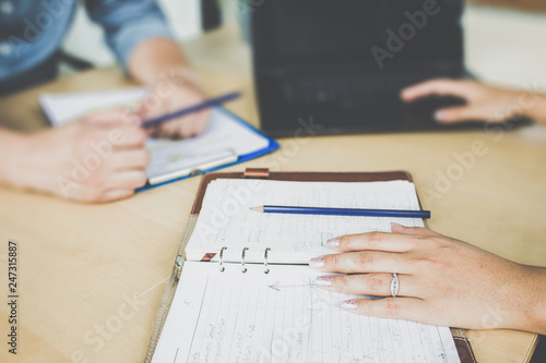 Legal team checking the fine print on business contract to analyze terms and conditions and sign.