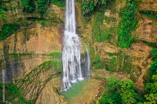Waterfalls in a mountain gorge in the tropical jungles of the Philippines  Cebu. Aerial view from the drone.