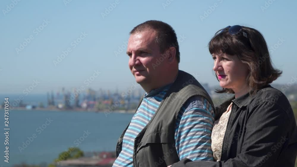 Married couple on the background of the seaport. Married couple on the background of the seaport.