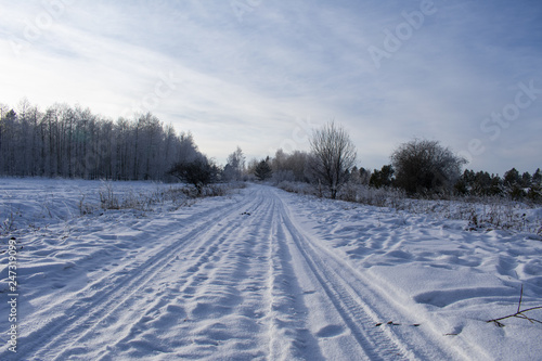 Winter road covered with snow near the village © Сергей Главинский