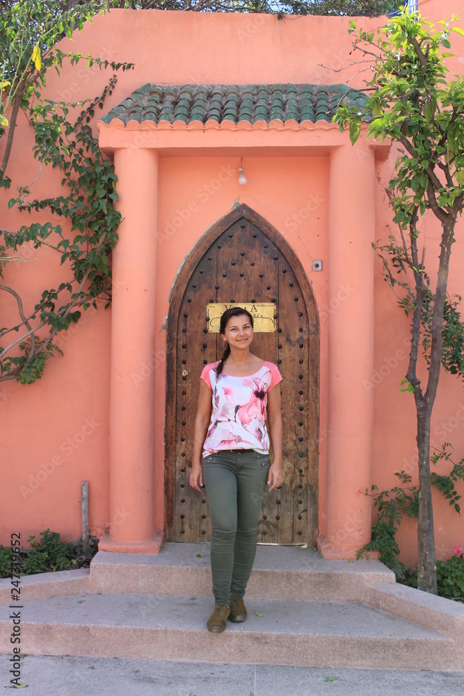 woman in front of door in marrakesh