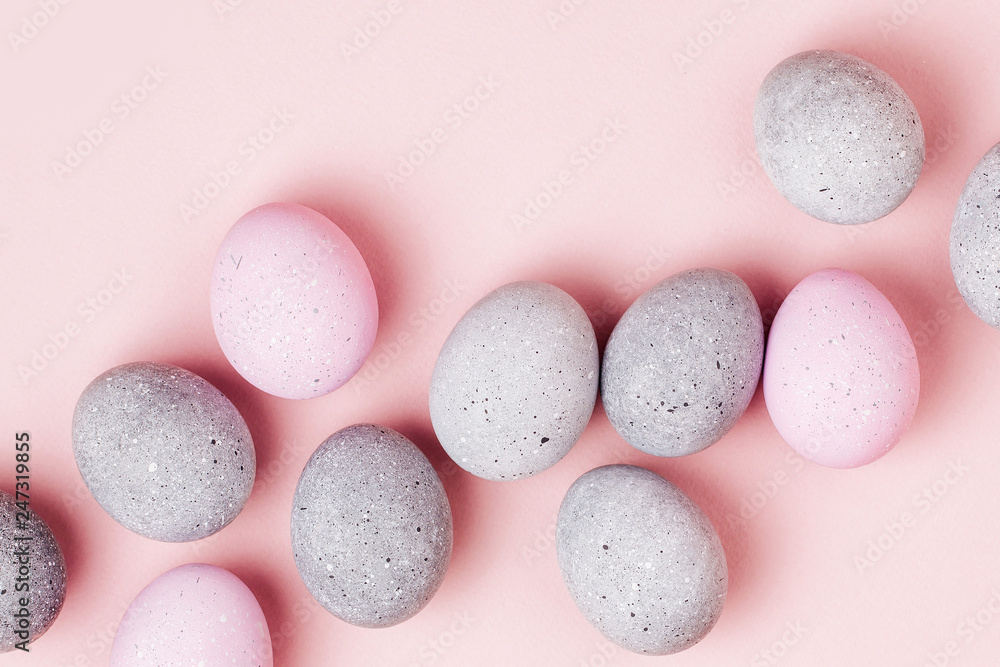 Stylish background of pale pink and gray Easter eggs. Dyed Easter eggs. Flat lay Stylish background of pale pink and gray Easter eggs. Dyed Easter eggs. Flat lay