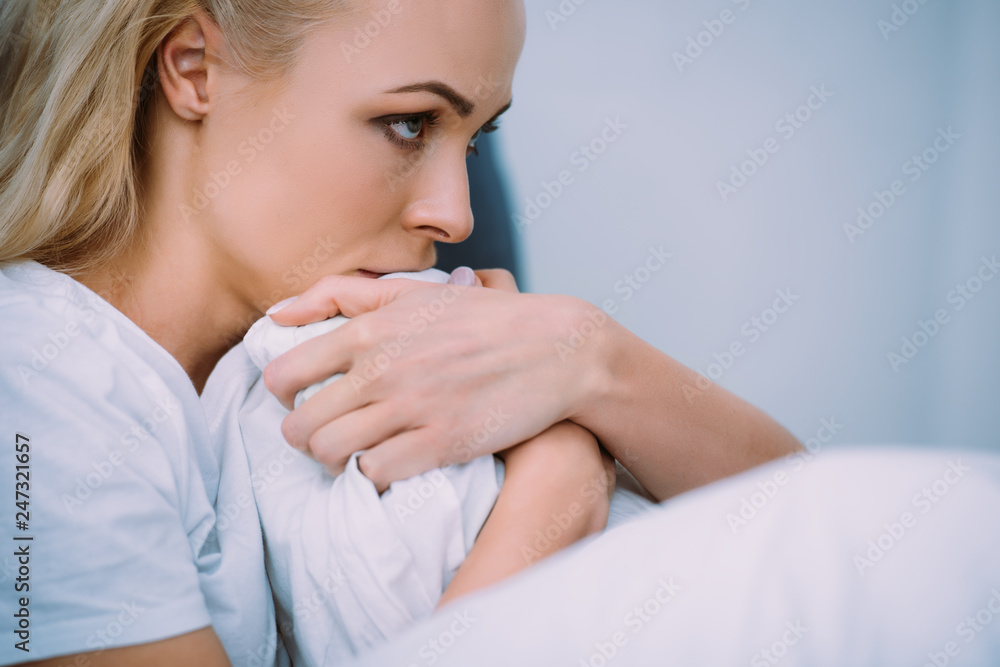 selective focus of scared woman covered with blanket in bed at home selective focus of scared woman covered with blanket in bed at home