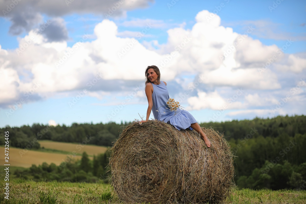 Two girls in dresses in summer field Two girls in dresses in summer field