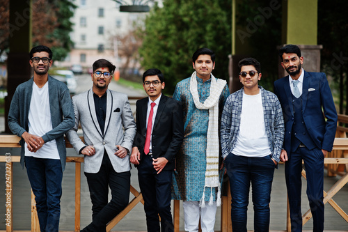 Group of six south asian indian mans in traditional, casual and business wear.