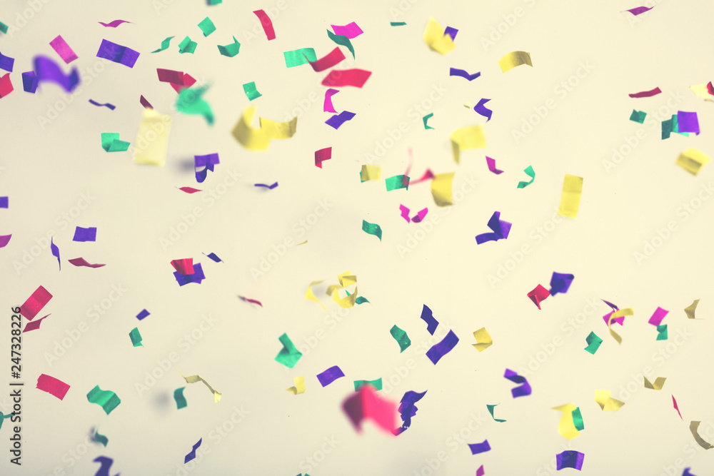 Falling confetti on creamy background. Falling confetti on creamy background.
