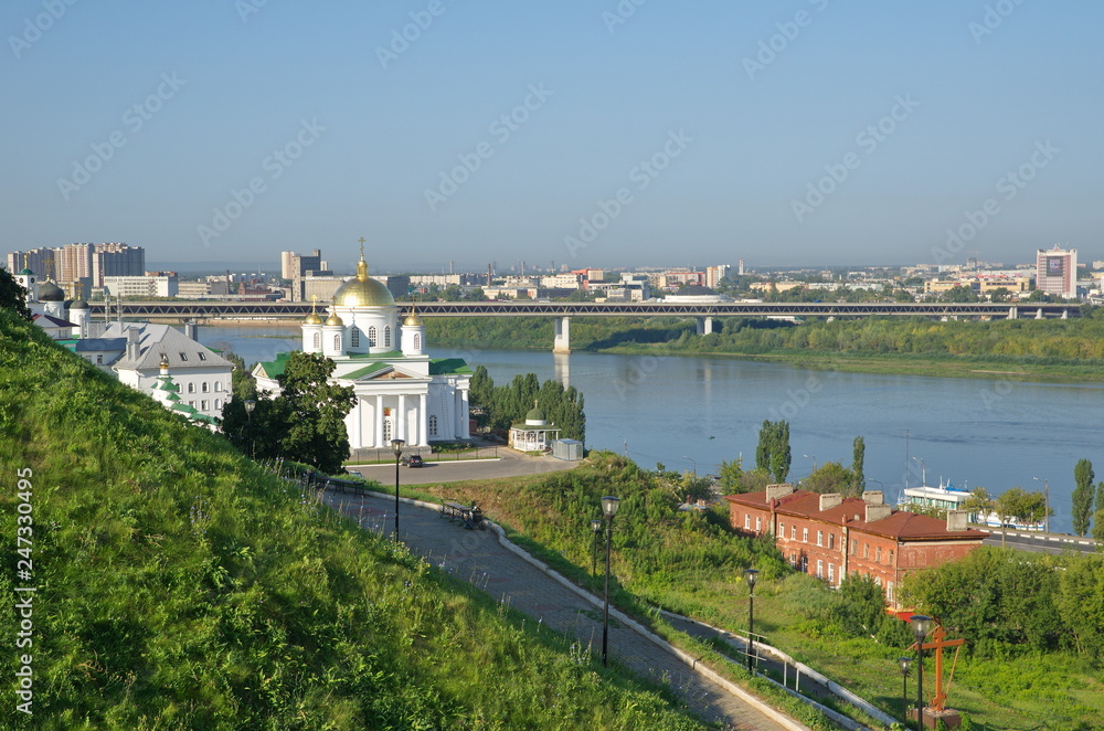 Fototapeta premium Summer view of the Annunciation monastery and the Church of Metropolitan Alexy of Moscow on the Bank of the Oka in Nizhny Novgorod, Russia