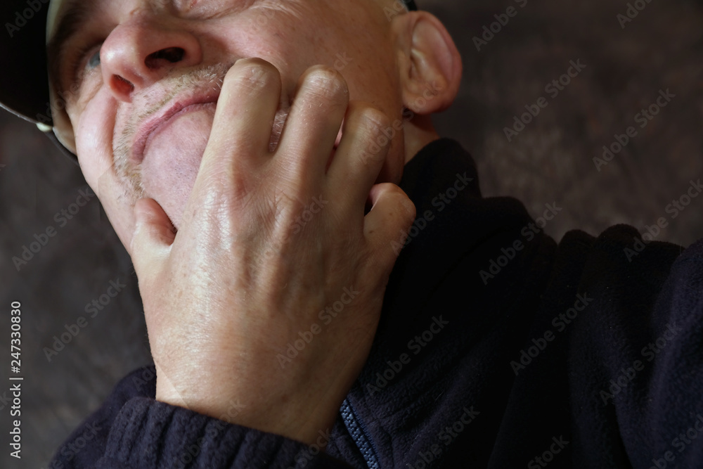 Fototapeta premium uncertain man scratching his face