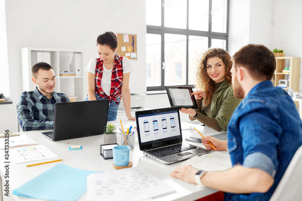business, technology and people concept - creative team or designers working on user interface at office business, technology and people concept - creative team or designers working on user interface at office