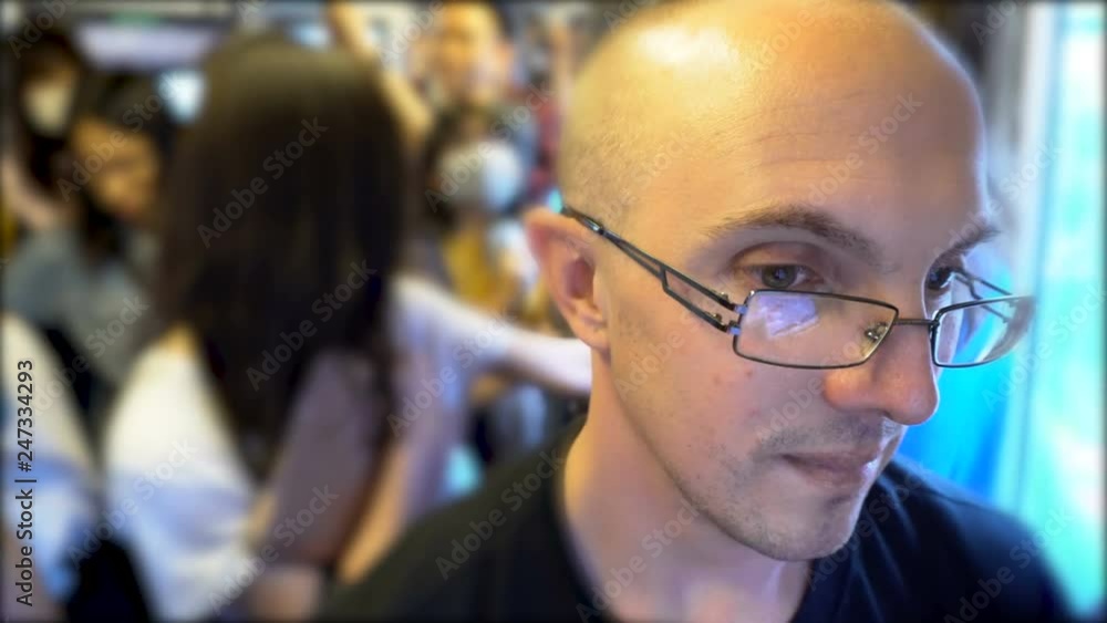 Face Close Up of Man inside Crowded Subway Train During Rush Hour Face Close Up of Man inside Crowded Subway Train During Rush Hour