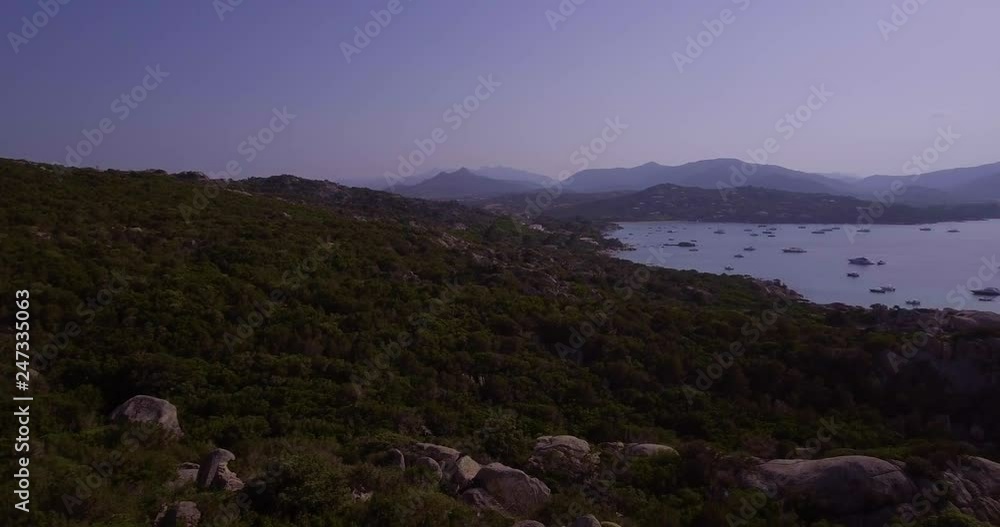 Aerial, Sardinia island and its rocky shore with mediterranean vegetation and beautiful emerald sea