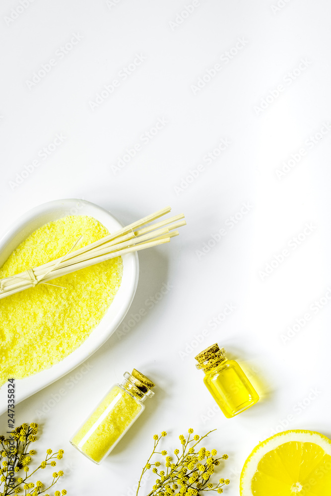 Cosmetic oil and sea sail for bath white background top view Cosmetic oil and sea sail for bath white background top view
