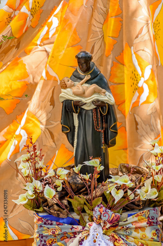 Saint Benedict, black-skinned saint carrying a child and traditional of the faith and Catholic religion of Brazil