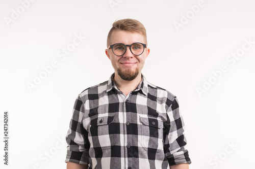 People, portrait and education concept - Smiling student man in plaid shirt over white background © satura_