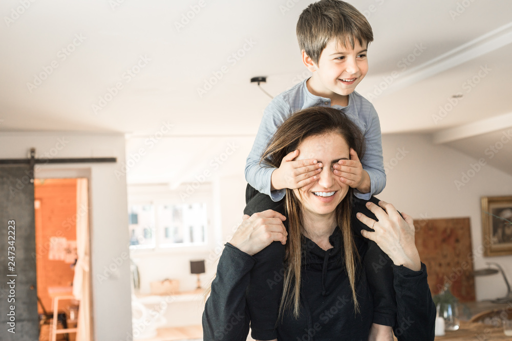 Child playing with his mother at home. Son and a mother with happy expression and smiling. Child playing with his mother at home. Son and a mother with happy expression and smiling.