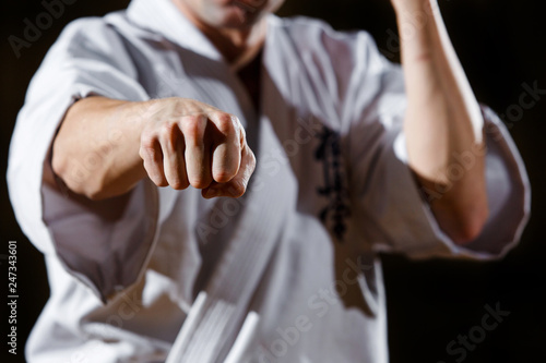 Close up man fist. Anger concept. Self defence training. Attack gesture