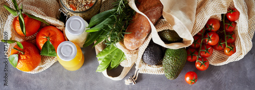 Set of fresh organic groceries in fabric bags