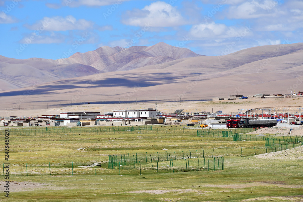 China, Tibetan plateau. Mountain settlement Yakra in summer in sunny day
