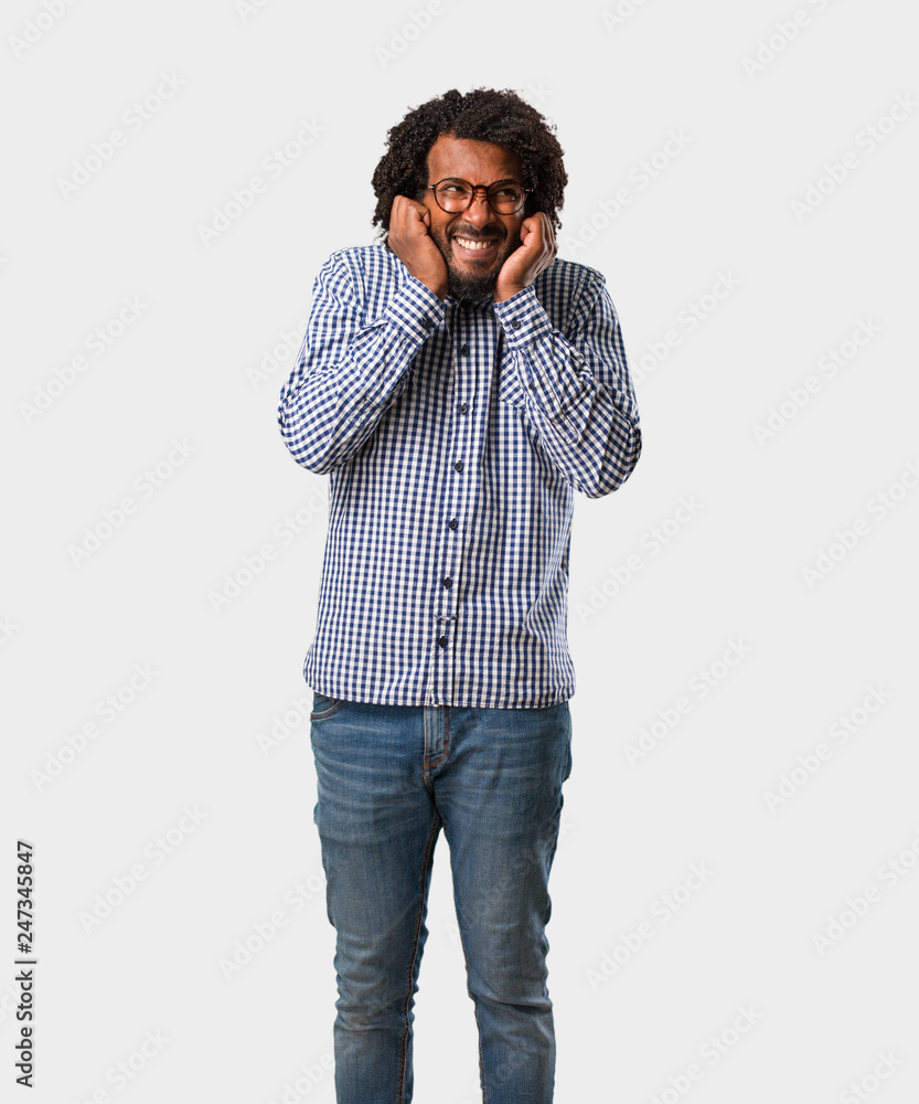 Handsome business african american man covering ears with hands, angry and tired of hearing some sound Handsome business african american man covering ears with hands, angry and tired of hearing some sound