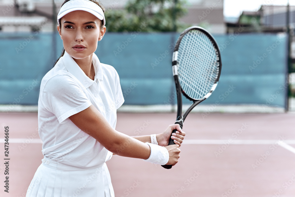 Waiting for the return. Attractive woman play tennis