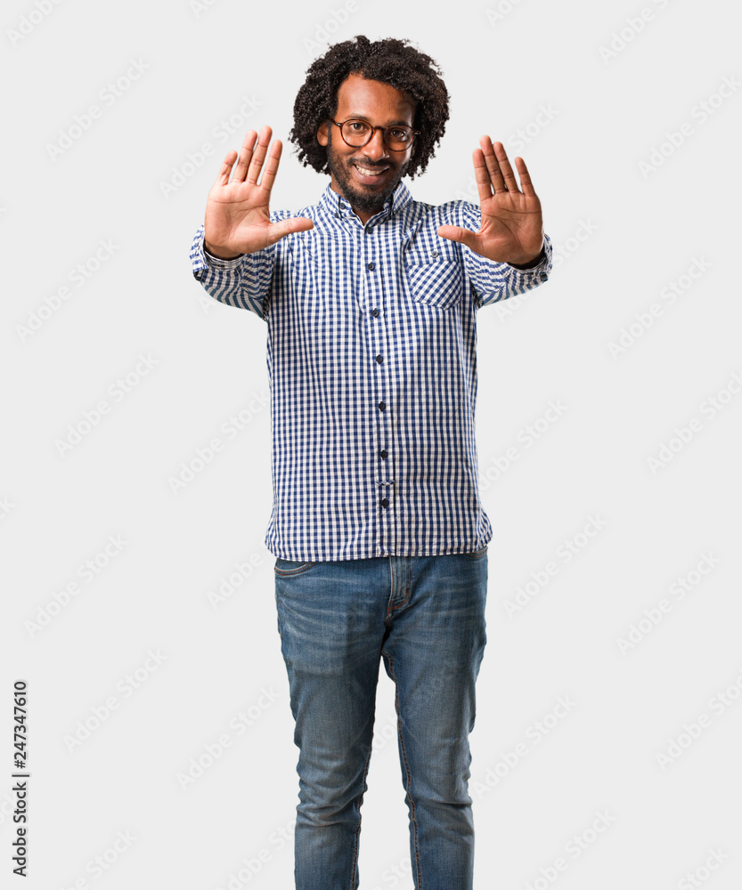 Handsome business african american man serious and determined, putting hand in front, stop gesture, deny concept Handsome business african american man serious and determined, putting hand in front, stop gesture, deny concept