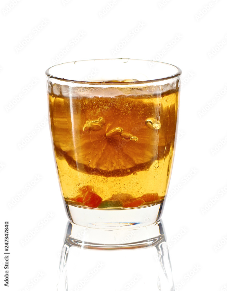 A glass of cold drink with lemon. Splash, splash fluid. Isolated. A glass of cold drink with lemon. Splash, splash fluid. Isolated.