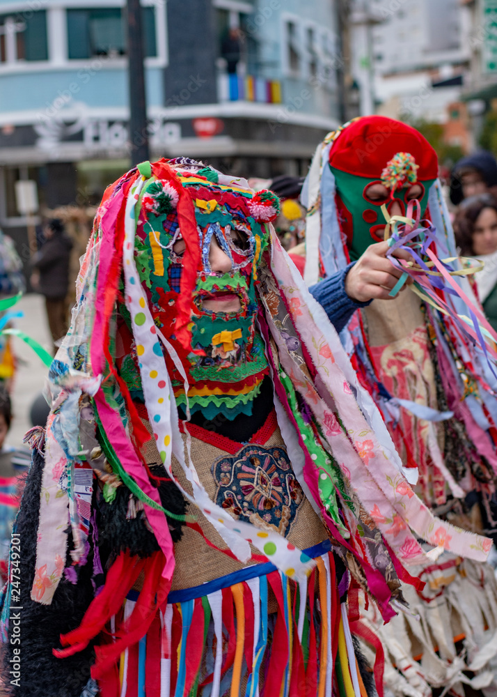 Fototapeta premium Colourful dressed masked men in the Carneval in Bragança, Portugal
