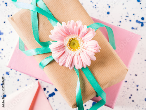 Stacked gift boxes with flowers. Pastel colors © tenkende